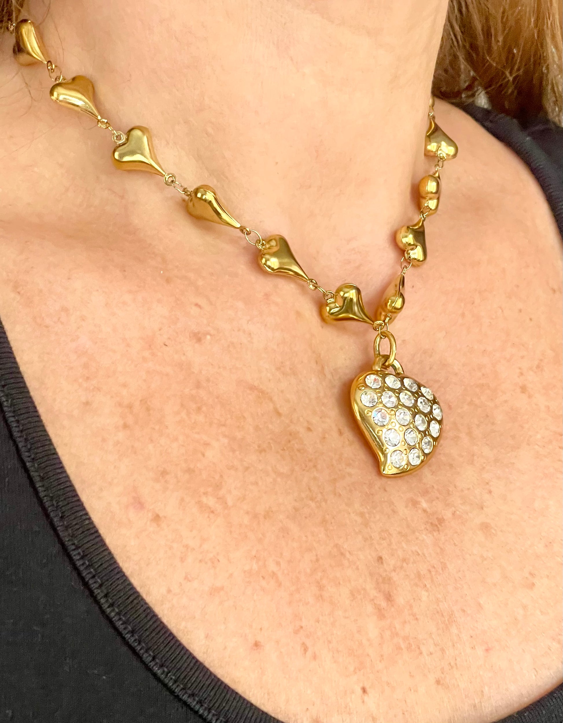 Side view worn by model Vintage YSL rhinestone heart pendant necklace showing size and gold chain detail, Valentine's Day gift