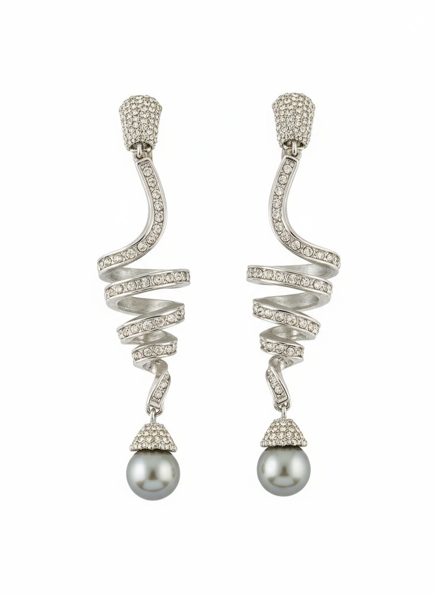 Grossé silver-tone drop earrings with rhinestones and grey pearl on white background 