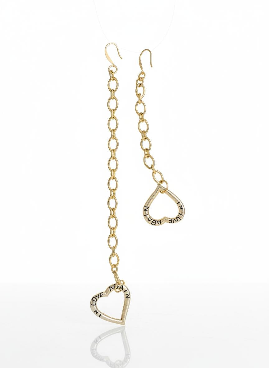 Yves Saint Laurent upcycled heart pendant earrings, front view on white background