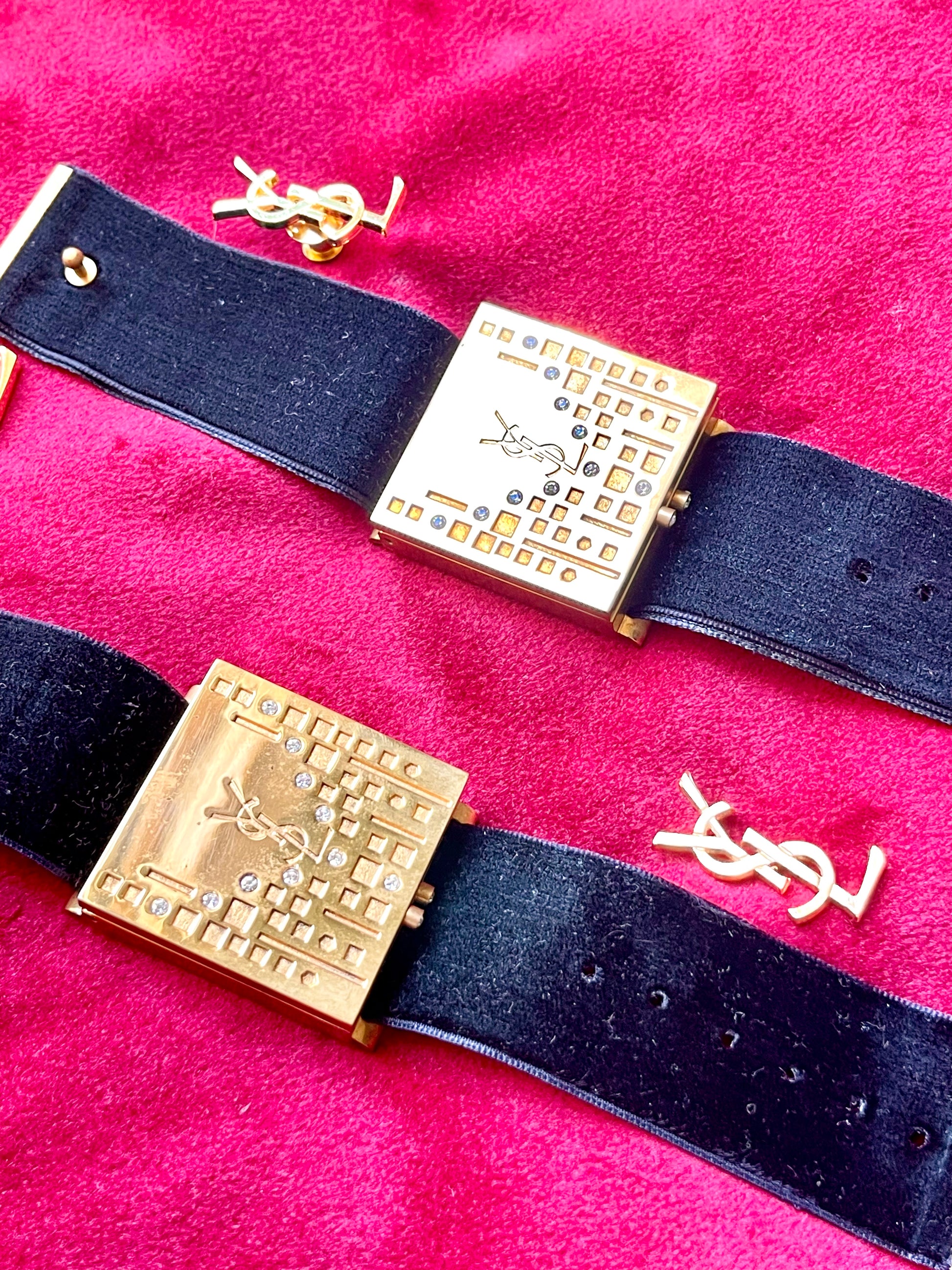 Side view Fashion Bracelet makeup Yves Saint Laurent vintage 2000 displayed with YSL pins on a red velvet background 