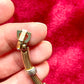 Authentic signed Vintage Christian Dior two-tone necklace with ribbed accents displayed on a red velvet background
