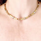 Vintage Christian Dior two-tone necklace worn around the neck, showcasing its elegant designer style