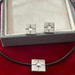 Vintage Yves Saint Laurent silver 925 earrings and pendant necklace set displayed on a red velvet background With their package 