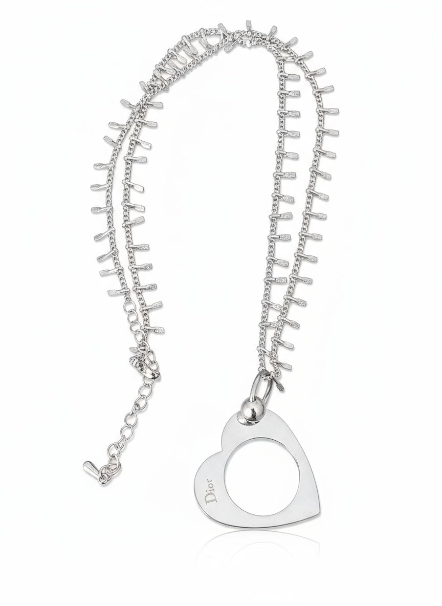 Vintage Dior charm pendant necklace with a silver plated adjustable chain from the brand Come.