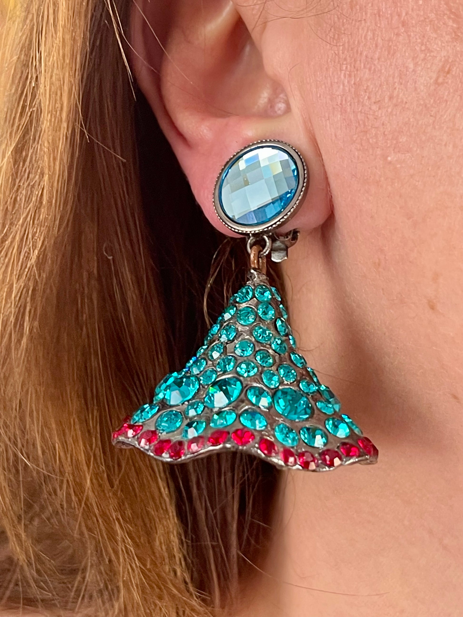 Close-up of Yves Saint Laurent Rive Gauche vintage statement earrings with turquoise and red rhinestones worn by model right side 