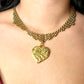 Worn by model Vintage Refurbished 18KG Yves Saint Laurent 80s pendant Monet gold necklace 