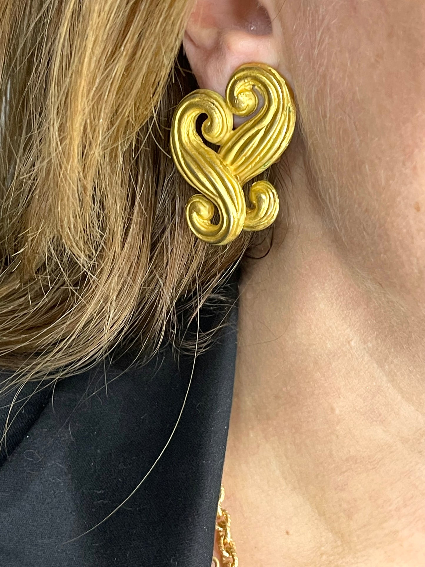 Vintage Nina Ricci statement heart earrings shown worn for scale