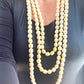 YSL vintage pearl necklace styled with classic outfit, adding elegant statement jewelry to a chic ensemble