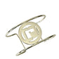 Vintage Paco Rabanne Parfums logo cuff bracelet refurbished with white gold On a white background 