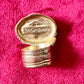 Back of a vintage Yves Saint Laurent ring, showing slight wear on the gold metal band, consistent with its vintage character. Authentic signed , size 7