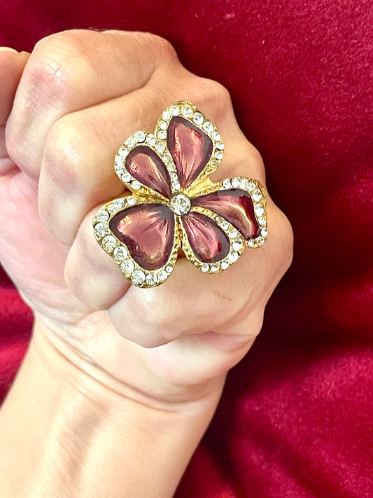 Yves Saint Laurent vintage floral ring on hand, featuring metallic pink enamel petals and crystal accents authentic rare collection 