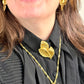 Vintage accessories styling authentic Vintage Yves Saint Laurent 80s 90s gold tone leaf brooch excellent condition worn by model 