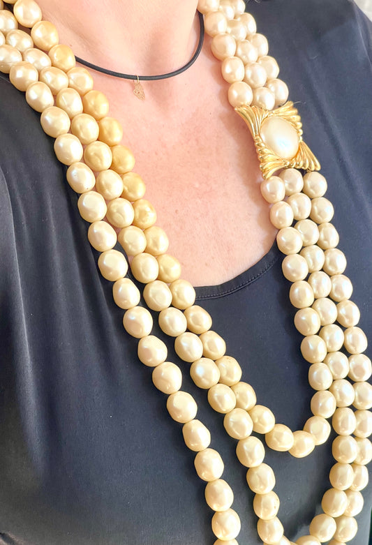 YSL vintage pearl necklace styled with classic outfit, adding elegant statement jewelry to a chic ensemble