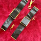 Back view Fashion Bracelet makeup Yves Saint Laurent vintage 2000 displayed with YSL pins on a red velvet background 