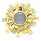 A vintage Paco Rabanne Paris brooch with a geometric design and a central milky cabochon stone, refurbished in 18K yellow gold.
