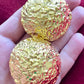 Vintage 80’s clip on earrings, repurposed with 18KG classic designer collectibles close up 