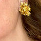 Orena Paris vintage gold sunflower-shaped earrings worn by model