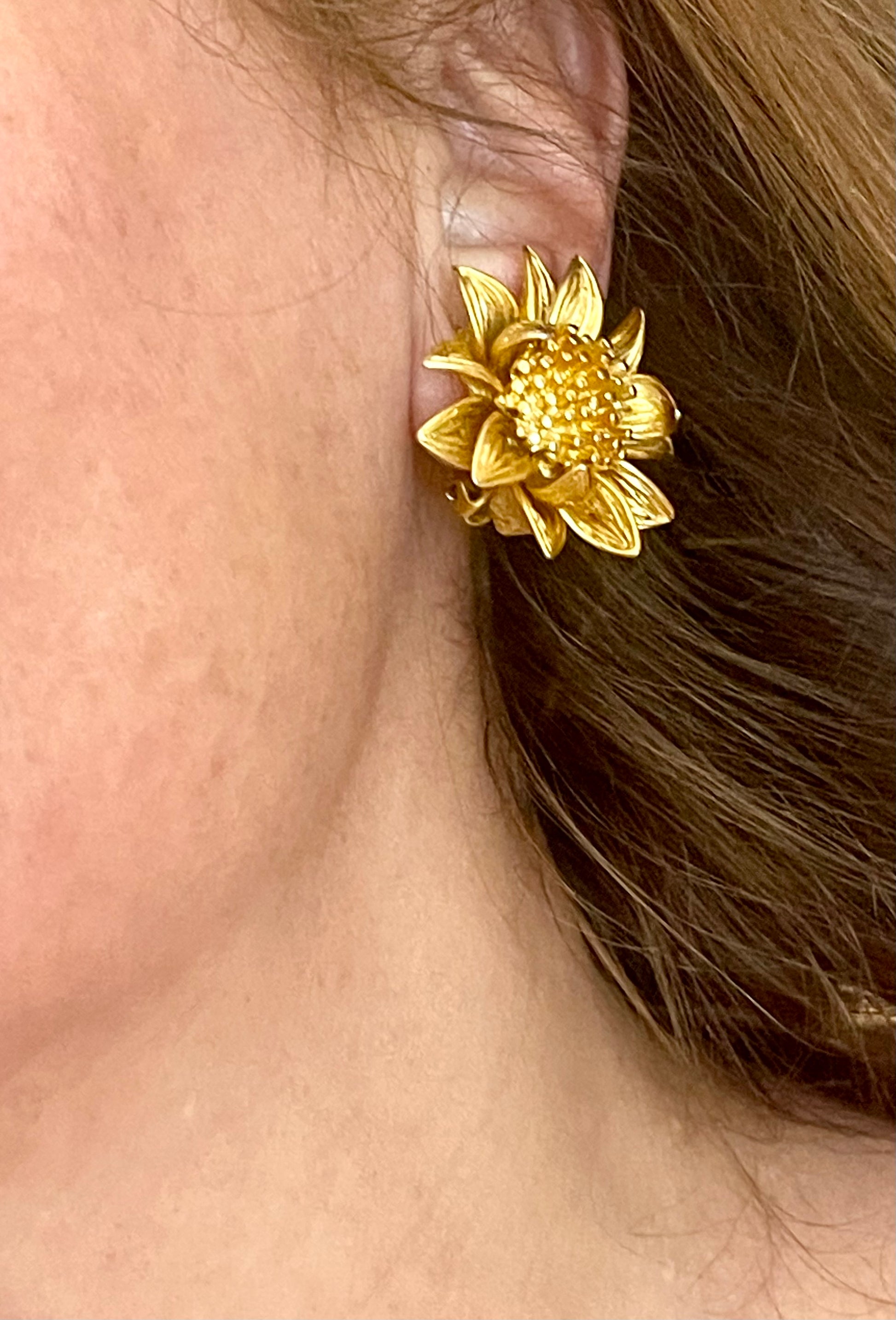 Orena Paris vintage gold sunflower-shaped earrings worn by model