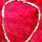 Back side Vintage Christian Dior two-tone necklace with ribbed accents displayed on a red velvet background