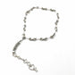 Authentic Dior phone charm upcycled into a silver-tone convertible pendant necklace, shown on white background