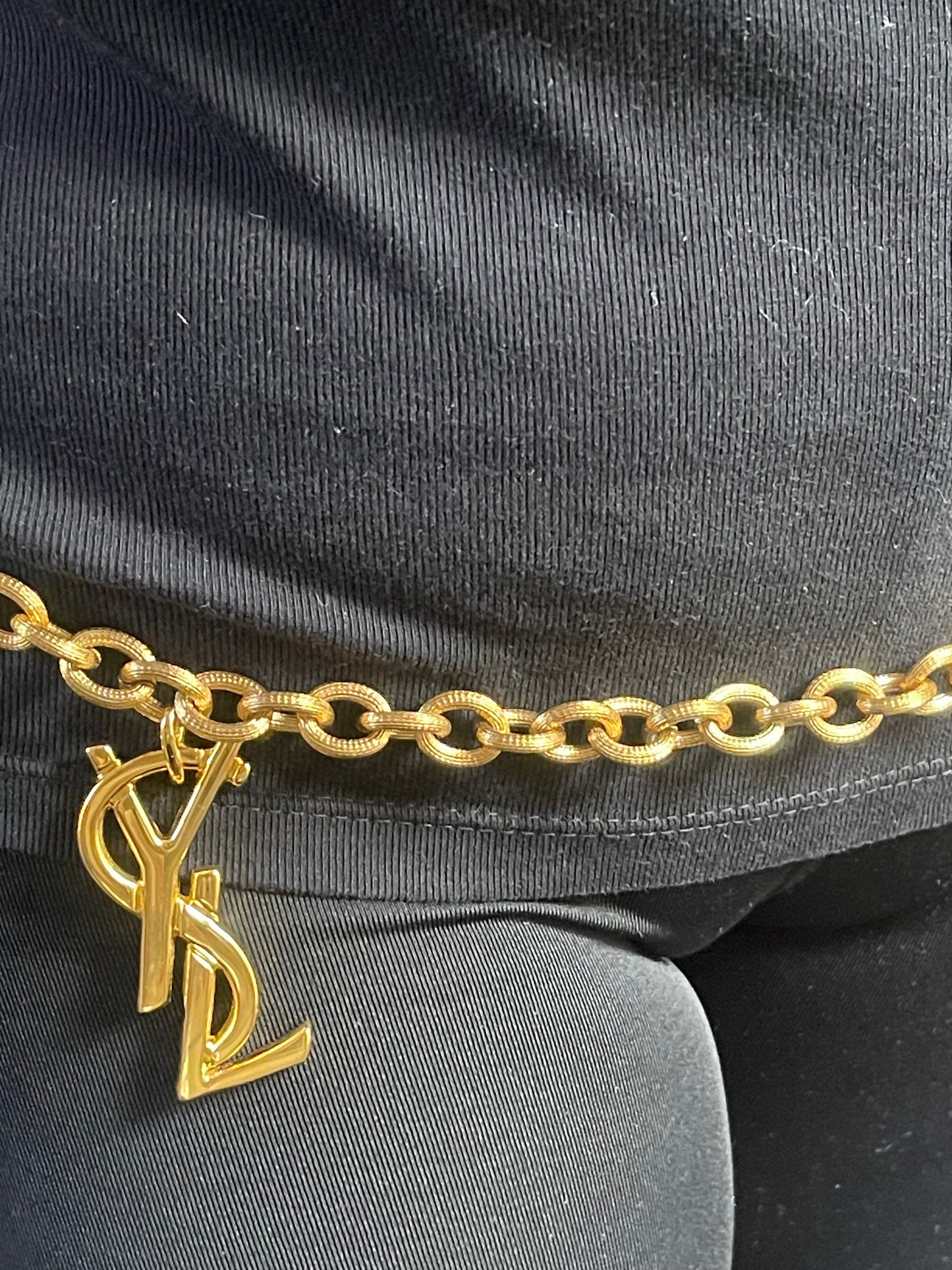 Large Yves Saint Laurent YSL logo pendant from vintage bag charm, styled as long belt.