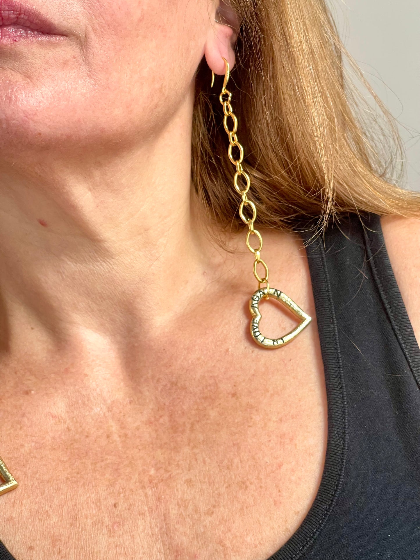 Short 14 cm YSL heart pendant earring on model