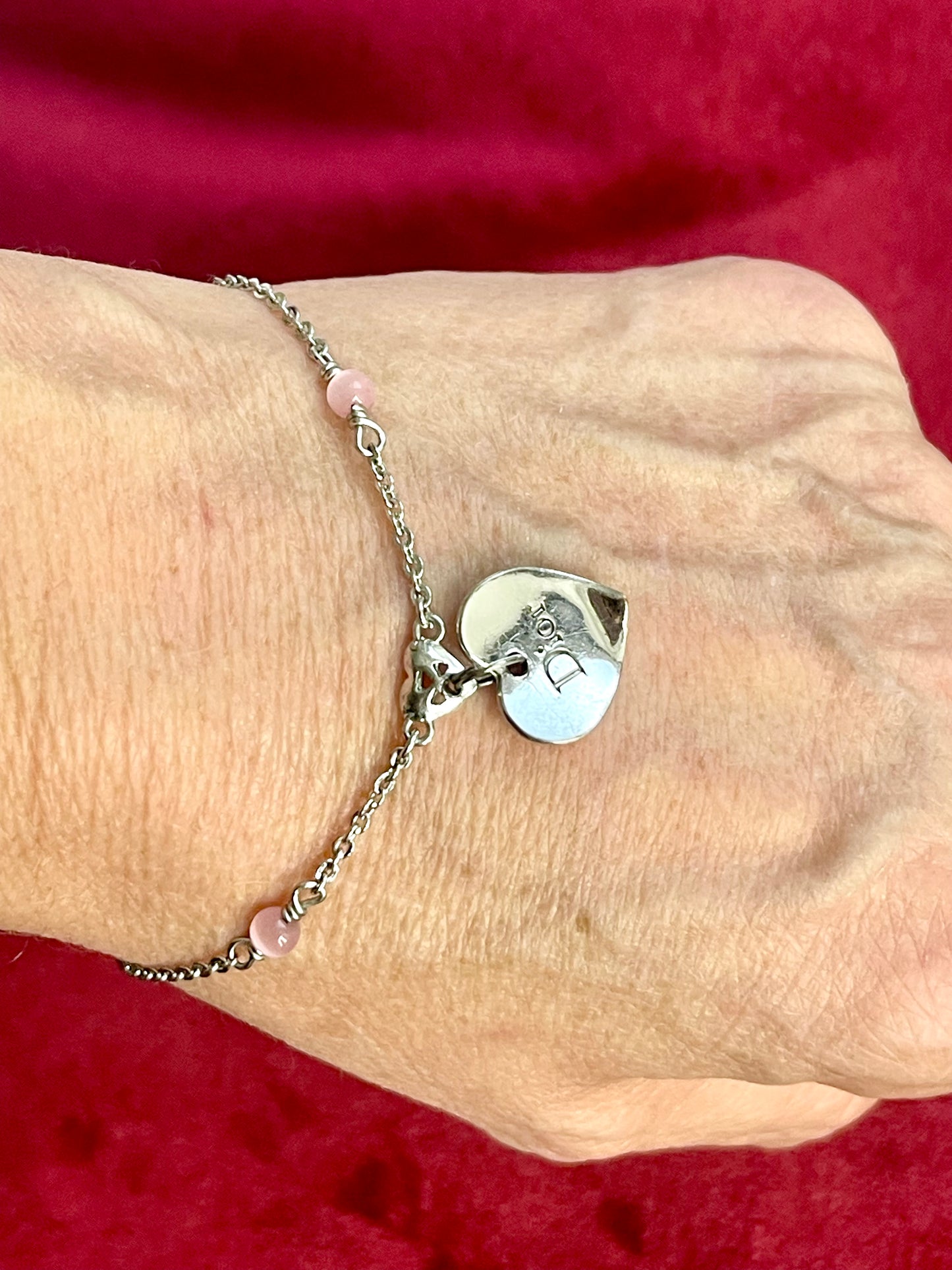 Bracelet authentique Dior vintage argenté avec breloque cœur et perles roses