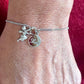 Pulsera Dior con dije de ángel en plata de ley