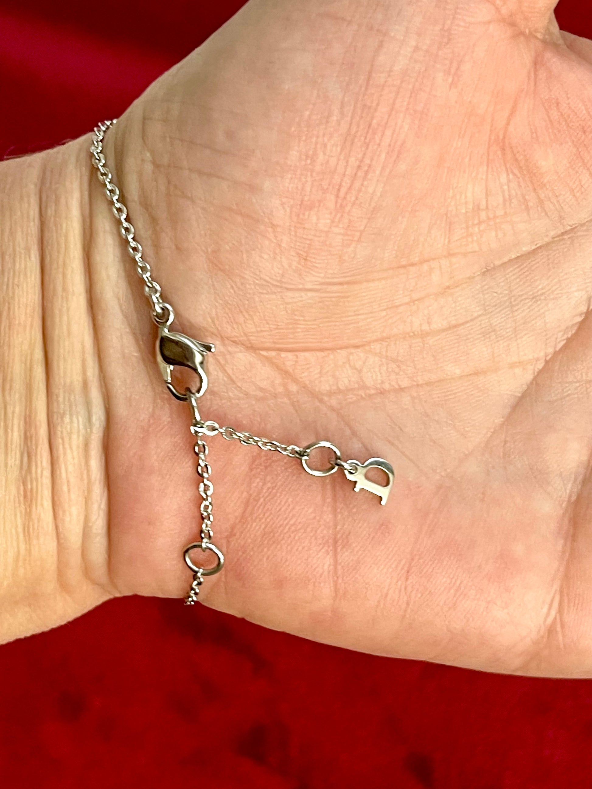 Worn on hand Dior lobster cluster with D charm of Vintage Dior silver tone rose beads chain bracelet 