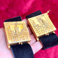 Bottom view on hand two Fashion Bracelet makeup Yves Saint Laurent vintage 2000 displayed with YSL pins on a red velvet background 