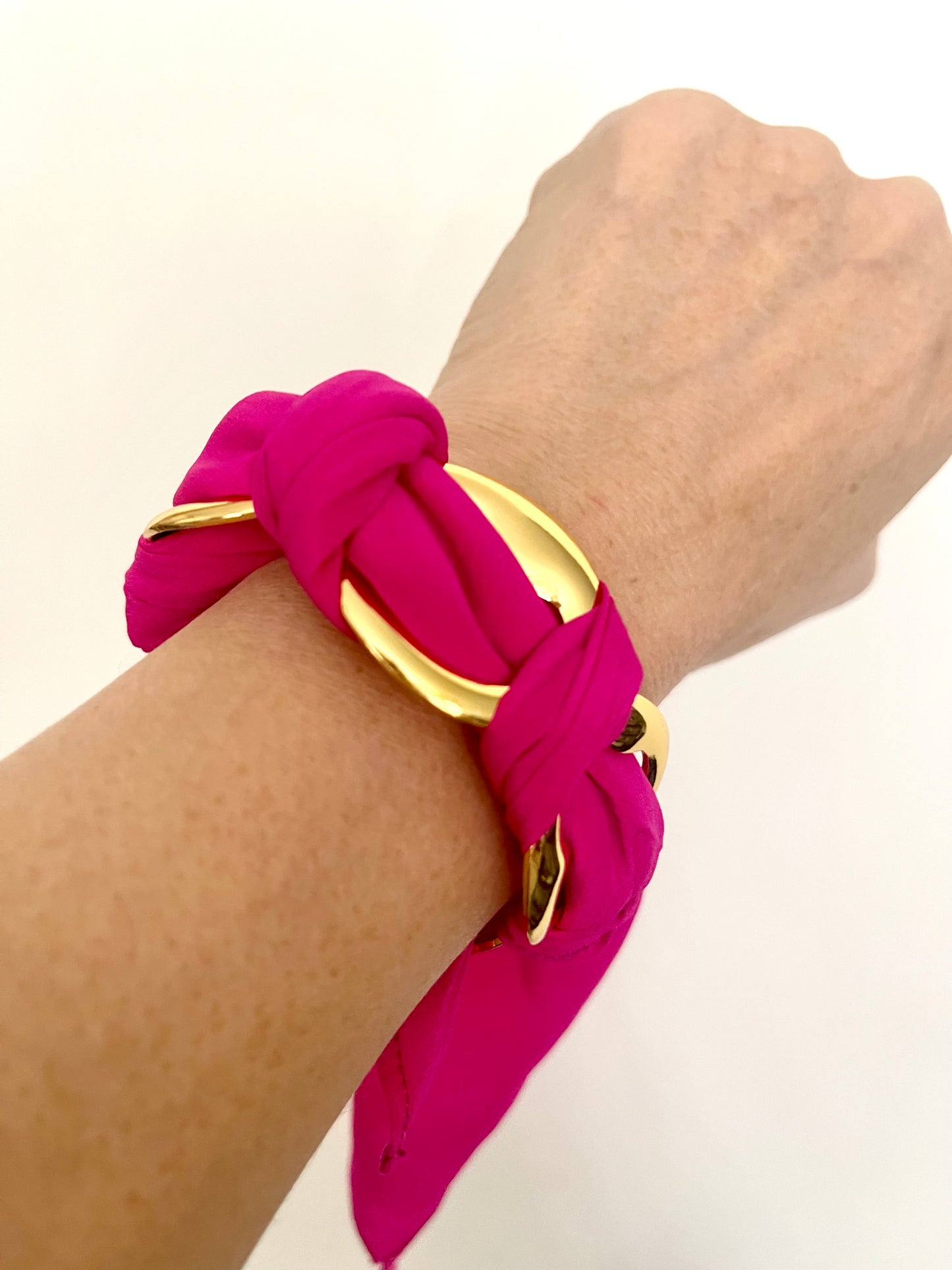 Gold stainless steel bracelet worn with silk Dior scarf styling