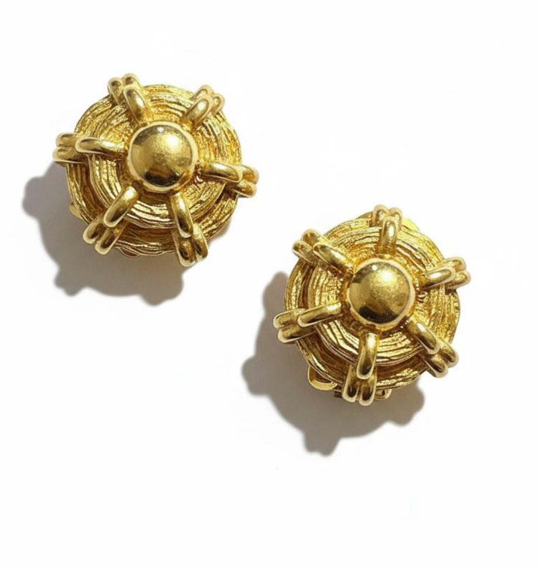 Pair of gold vintage Dior earrings on a white background