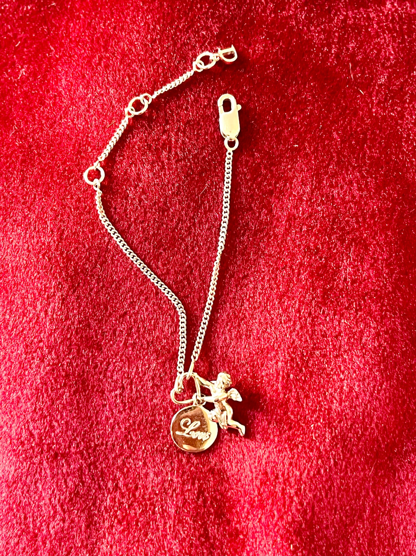 Pulsera Dior con dije de ángel en plata de ley