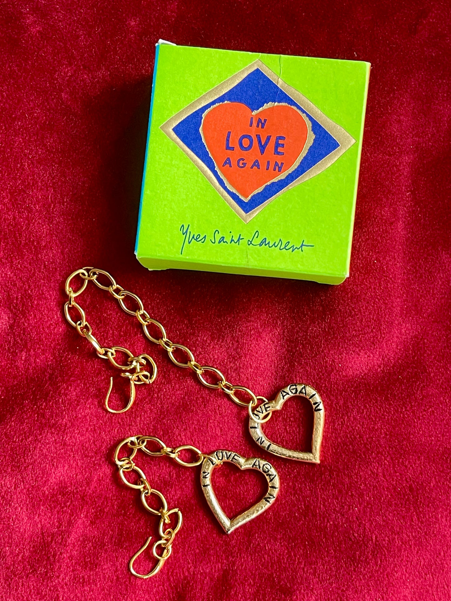 Asymmetrical gold-plated YSL earrings with vintage pendants