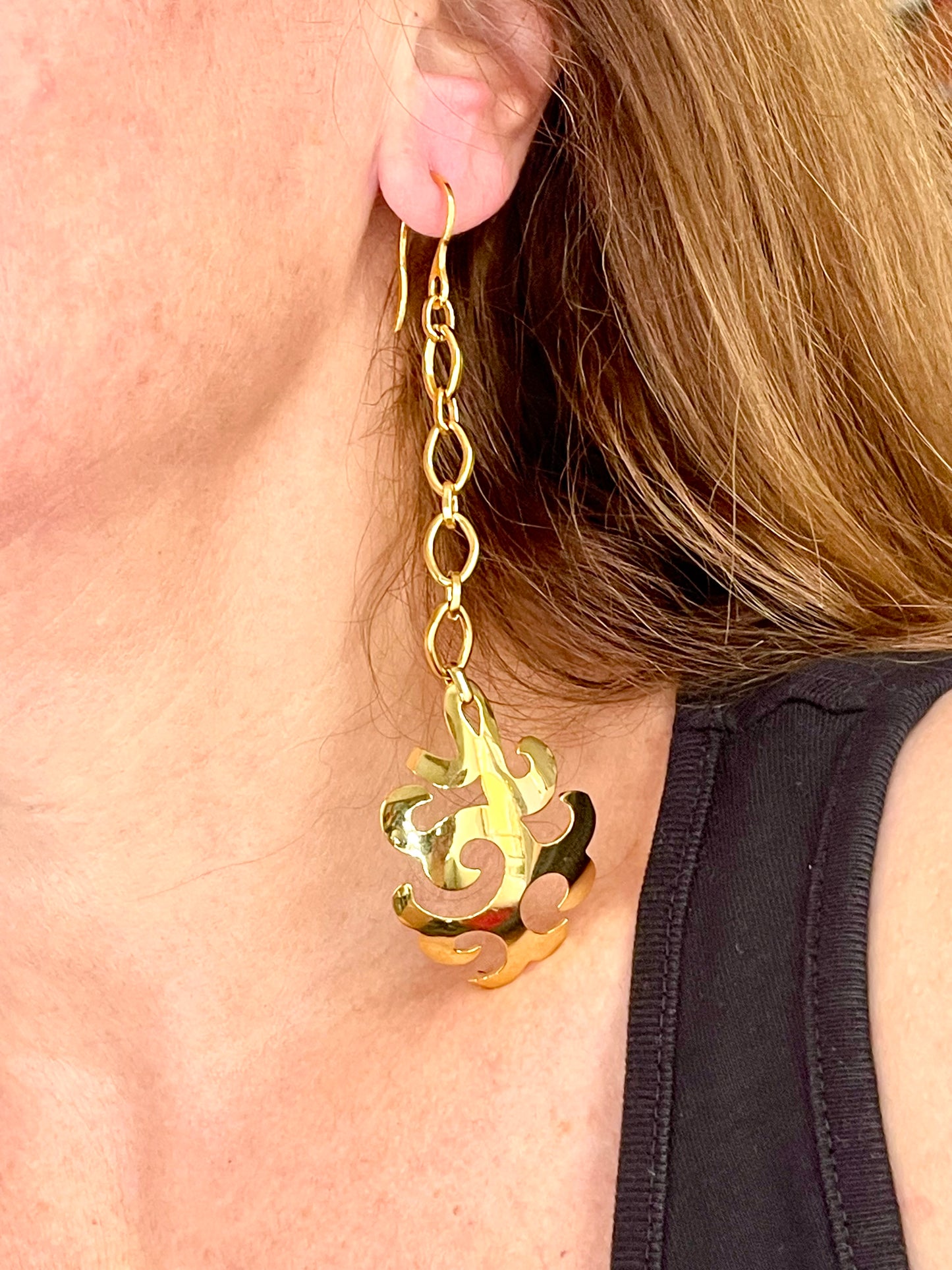 Yves Saint Laurent long drop earrings photographed from different angle