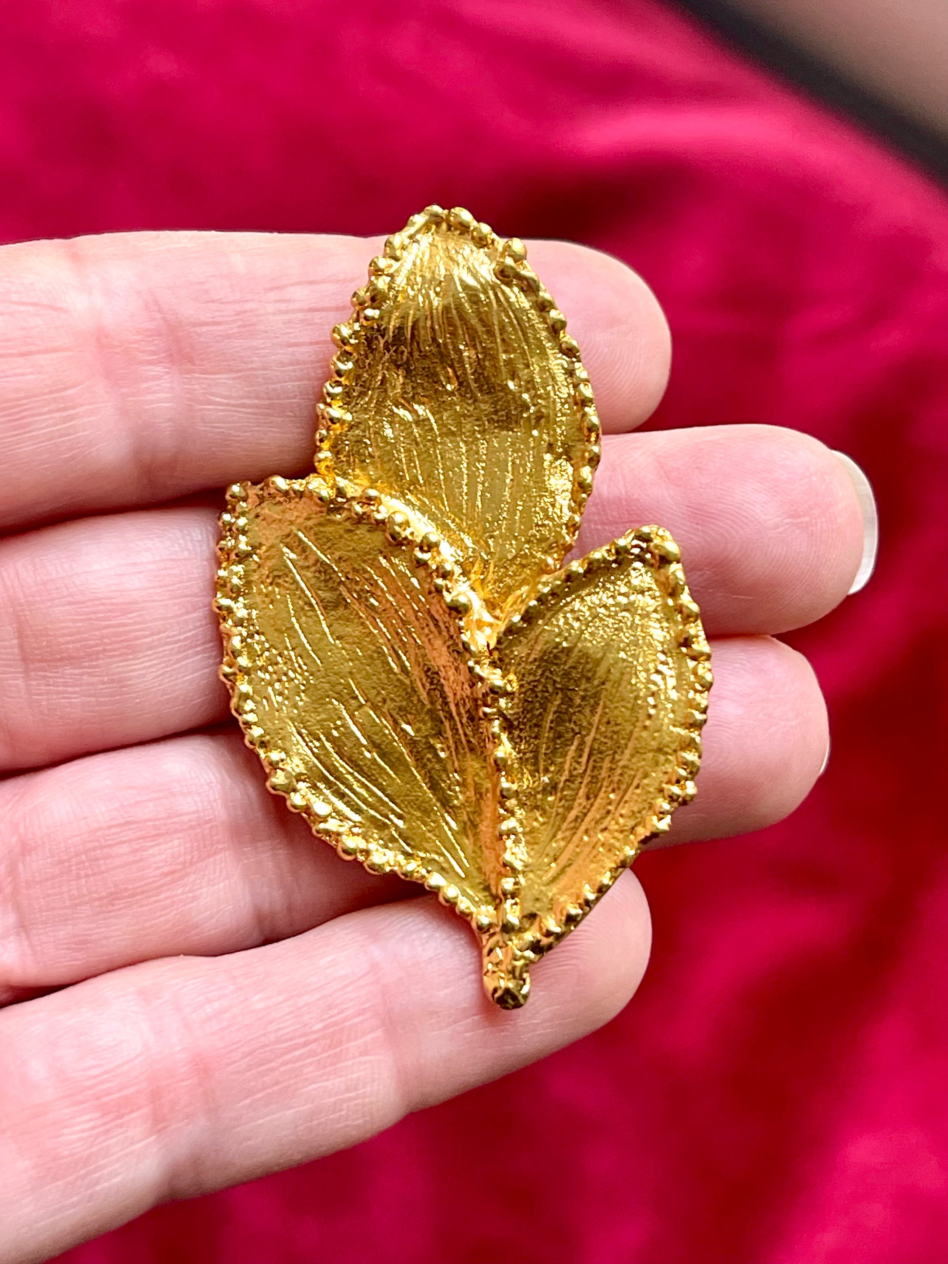 Close up Vintage Yves Saint Laurent 80s 90s gold tone leaf brooch excellent condition on hand 