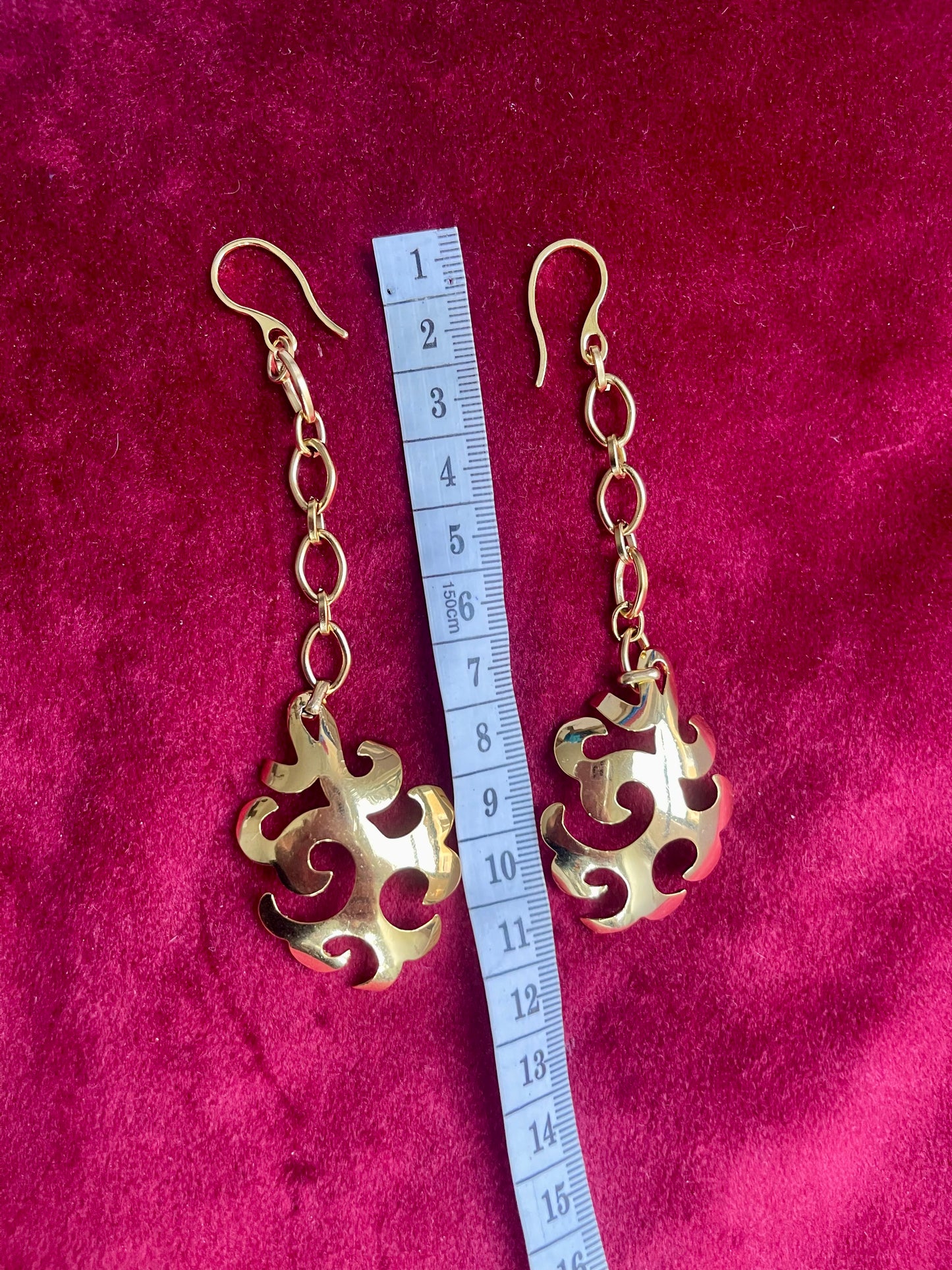 Vintage YSL statement earrings showing elegant movement and length Using a measuring tape 