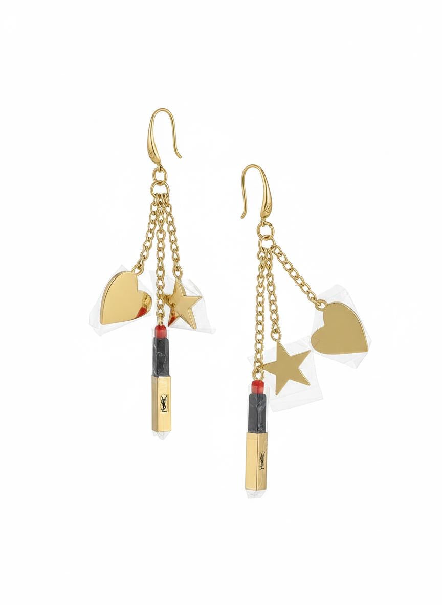 Front view of Yves Saint Laurent Beauté upcycled earrings with lipstick, star, and heart charms on gold-plated hoops On white background 