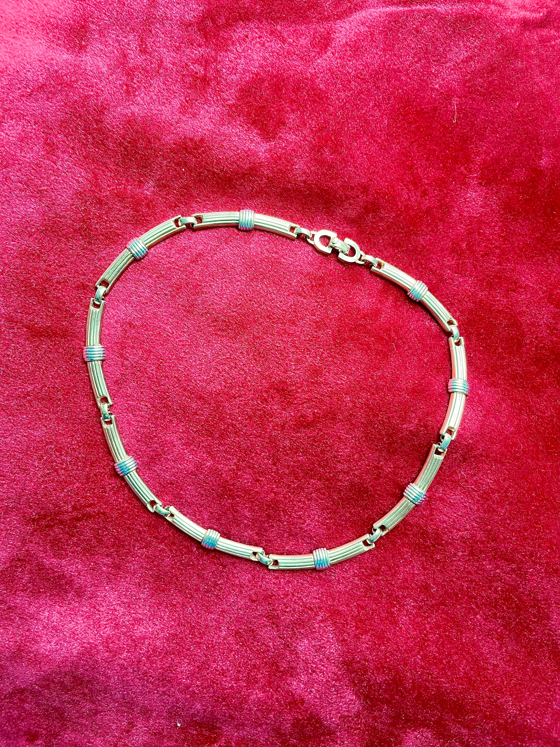 Authentic vintage Christian Dior two-tone necklace featuring gold and silver-toned ribbed links. Timeless designer elegance perfect for any occasion.