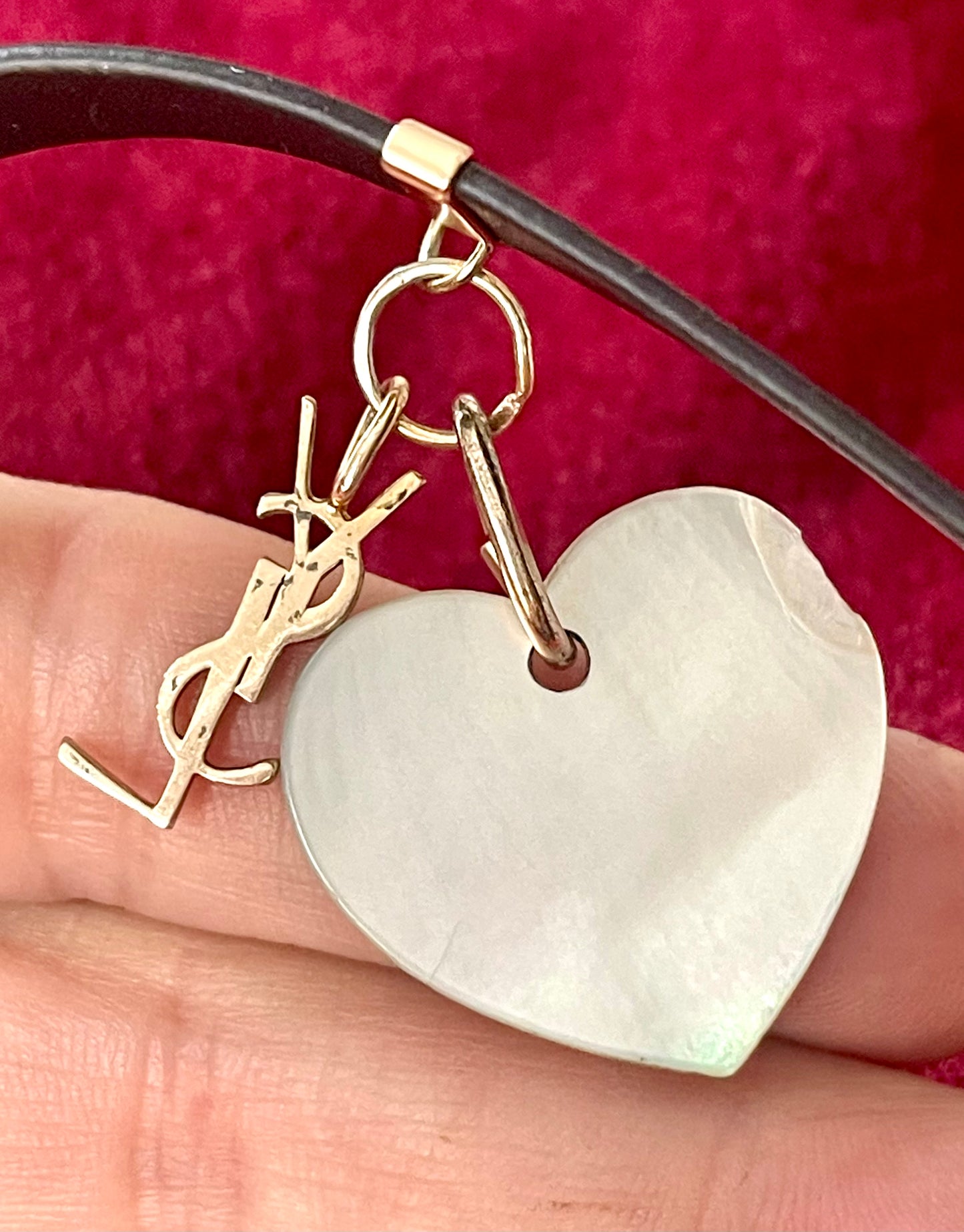 YSL vintage heart-shaped seashell pendant showing minor chip and gold-plated silver hoops.