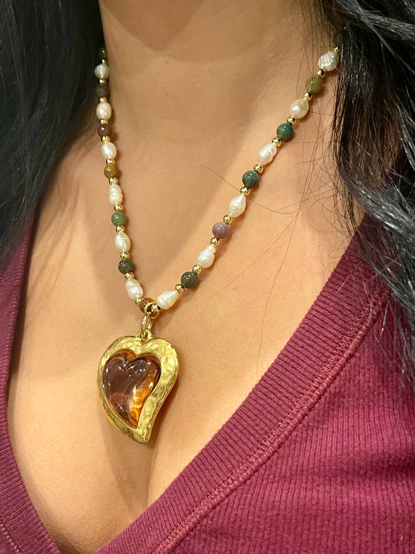 Side view of Vintage Yves Saint Laurent Flower petal pendant with a fresh water pearl and precious stones necklace, worn by model 