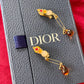 Boucles d'oreilles à épingles en or Dior