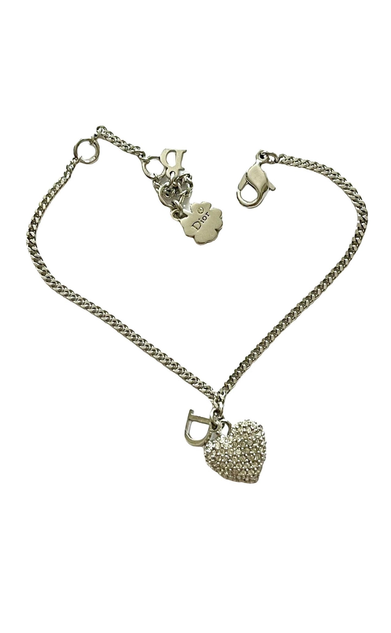 Pulsera auténtica vintage Dior con dije de corazón en tono plateado
