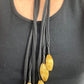 Close up at Vintage Yves Saint Laurent YSL scarf holder one of a kind art textile statement necklace worn on chest 