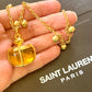 Pendentif Authentique Champagne Yves Saint Laurent Remis À Neuf Avec 18K