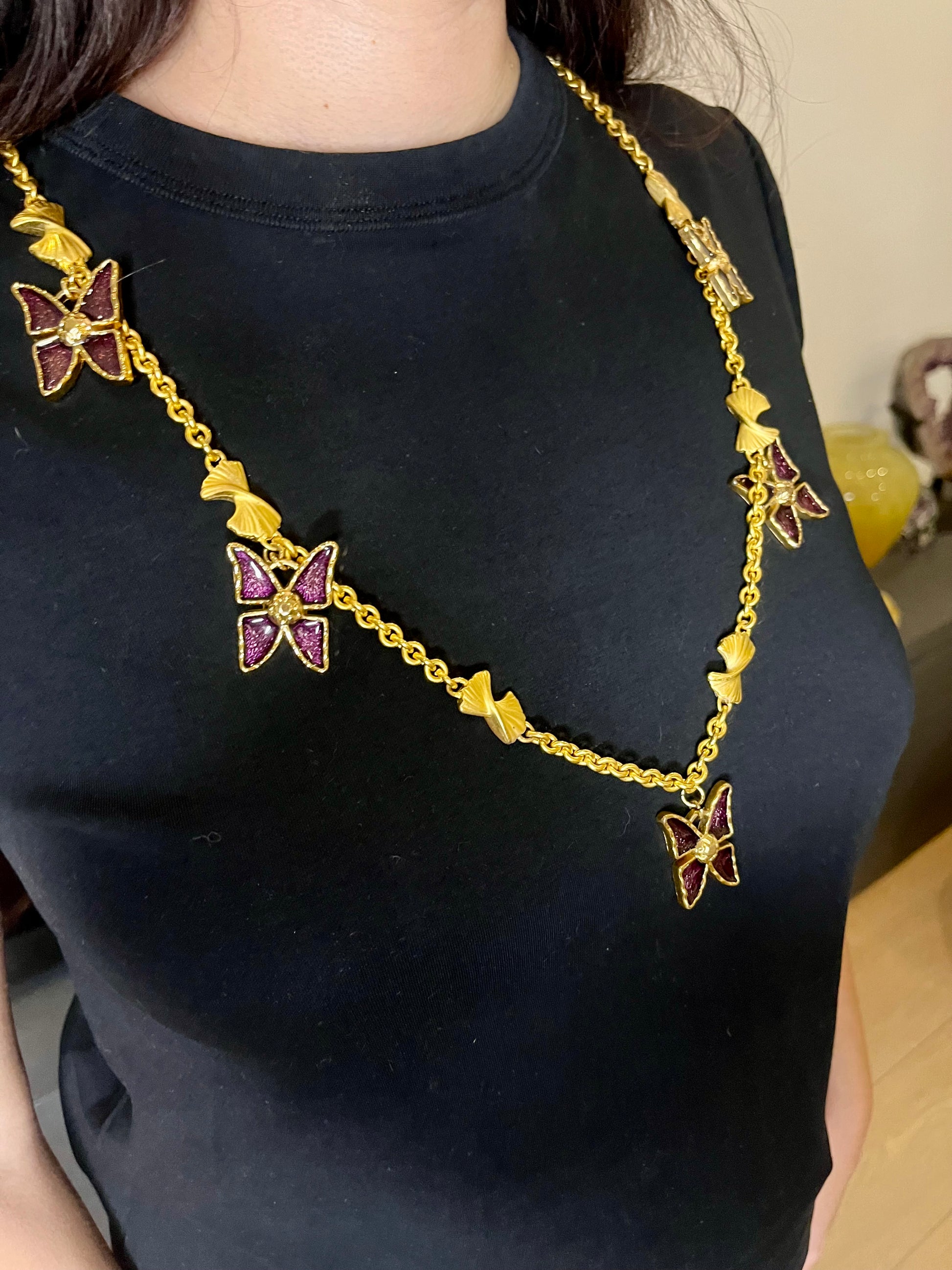 Worn by model on a black top Vintage 80s five Yves Saint Laurent Butterfly Enameled pendants mounted on a Nina Ricci gold necklace
