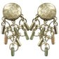 Silver Paco Rabanne 1980s vintage earrings with dangling charms on a white background