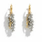 Gold and silver earrings with pearl-like beads and YSL Yves Saint Laurent charms on a white background