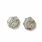 Vintage Silver  Yves Saint Laurent hexagonal Monogram earrings on a white background