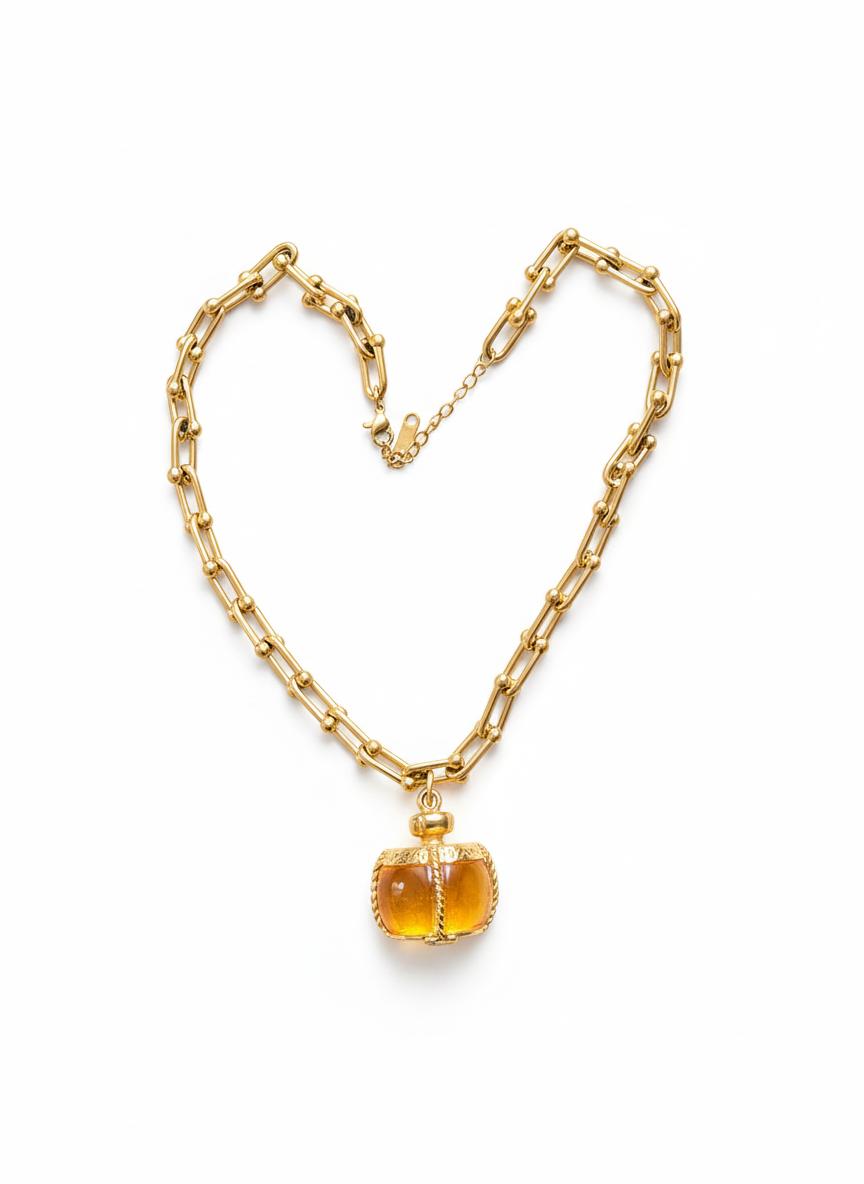 Vintage pendant from Yves Saint Laurent champagne perfume bottle 